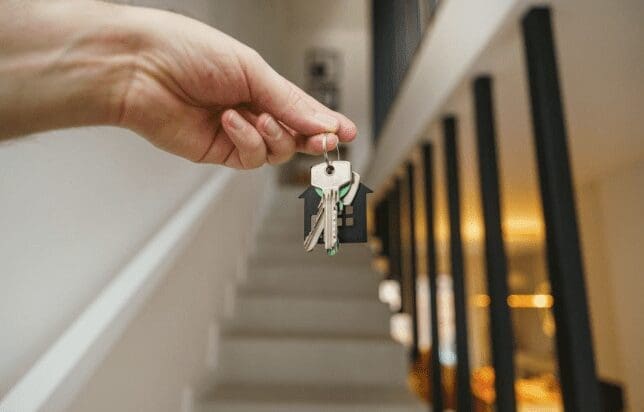A homebuyer gets keys to their new home.