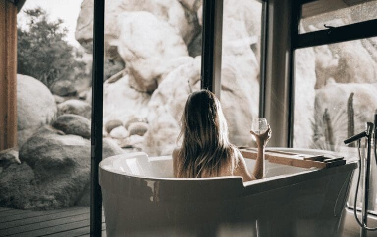 Woman relaxes in a bath