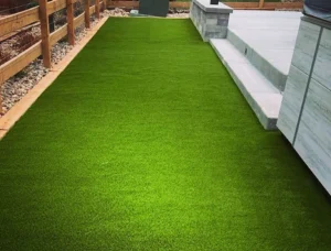 High-end Denver Metro backyard featuring artificial turf and native Colorado landscaping.