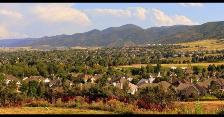Panoramic view of Ken Caryl neighborhood homes with Colorado Front Range mountains