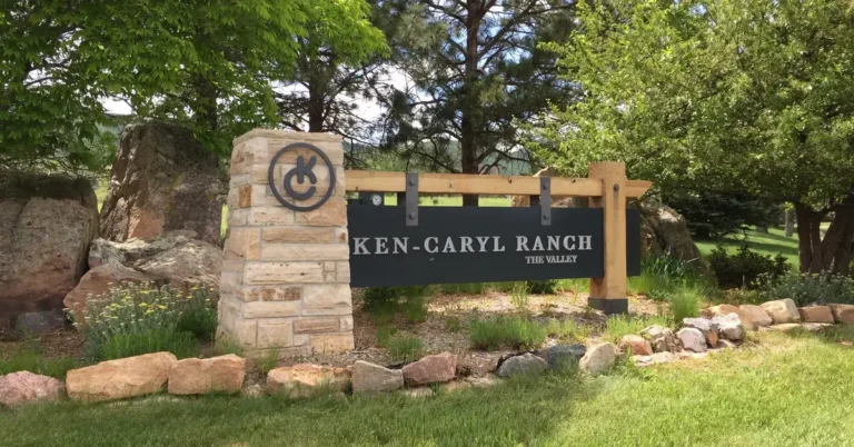 Best hikes Ken Caryl — Ken Caryl Ranch Valley sign with Colorado foothills