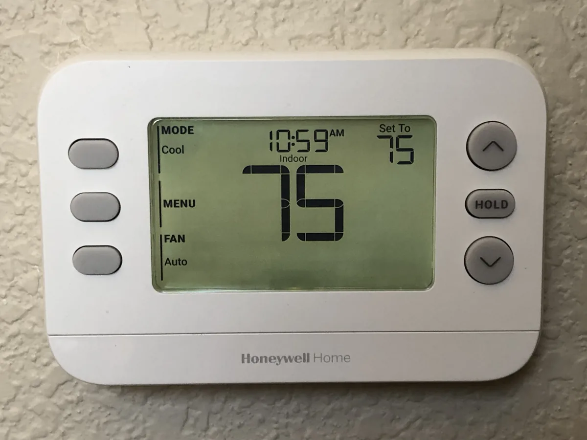 Home thermostat during a Colorado furnace replacement decision